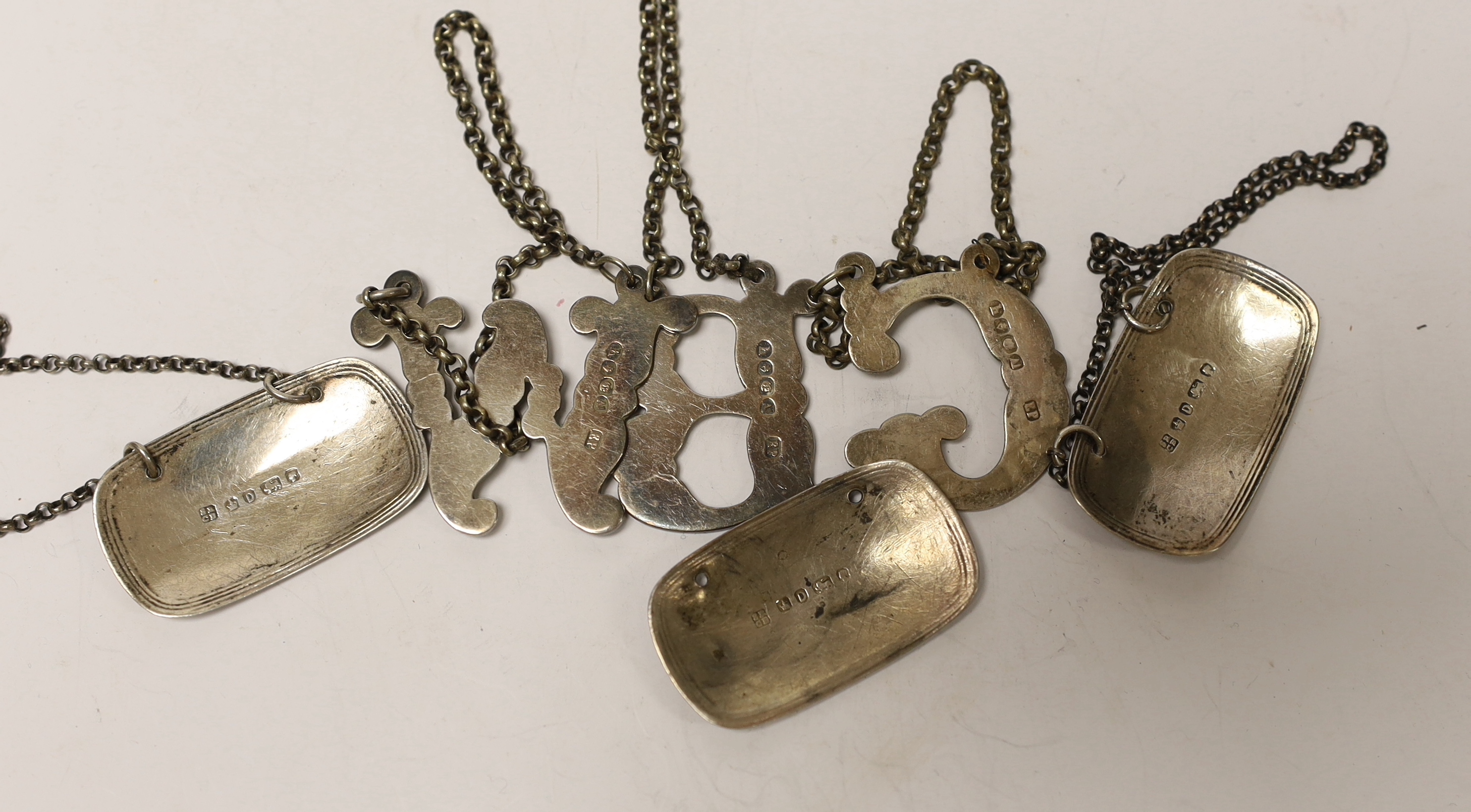 A set of three Victorian silver oval wine labels, Roberts & Belk, Sheffield, 1871, 43mm and three plated 'initial' wine labels.